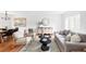 Inviting living area with neutral tones, modern furniture, and ample natural light at 6982 Estes Dr, Arvada, CO 80004