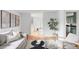 Cozy living room featuring hardwood floors, stylish furniture, and plenty of natural light at 6982 Estes Dr, Arvada, CO 80004