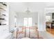 Bright, airy living room with built-in shelves and view to dining area at 6982 Estes Dr, Arvada, CO 80004