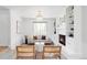 Bright living room with cozy fireplace, built-in shelving and comfortable furniture at 6982 Estes Dr, Arvada, CO 80004
