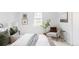 Bright bedroom featuring a cozy seating area with natural light from the window at 6982 Estes Dr, Arvada, CO 80004