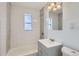 Bathroom featuring white subway tile, updated vanity, and modern fixtures at 1533 Xenia St, Denver, CO 80220