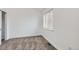 Clean, carpeted bedroom with a large window letting in natural light at 1533 Xenia St, Denver, CO 80220