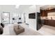 Bright, modern living room featuring a breakfast bar and sleek dark appliances at 1533 Xenia St, Denver, CO 80220