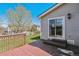 Wooden back deck with steps leading to a well-maintained, green lawn at 9508 Elk Mountain Cir, Littleton, CO 80125