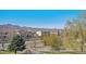 Expansive backyard with views of nearby houses and the Rocky Mountains at 9508 Elk Mountain Cir, Littleton, CO 80125