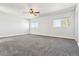 Spacious bedroom with a ceiling fan and dual windows providing natural light at 9508 Elk Mountain Cir, Littleton, CO 80125