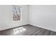 Bright bedroom featuring hardwood floors and a window offering natural light at 9508 Elk Mountain Cir, Littleton, CO 80125