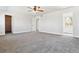 Large bedroom with neutral carpet, closet, and bright windows offering ample light at 9508 Elk Mountain Cir, Littleton, CO 80125