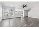 Spacious living room featuring new floors and big windows that provide lots of natural light at 9508 Elk Mountain Cir, Littleton, CO 80125