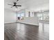 Open concept living room with new flooring and big, bright windows for natural light at 9508 Elk Mountain Cir, Littleton, CO 80125