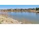 Scenic view of a tranquil pond surrounded by well-maintained homes in a desirable community at 9508 Elk Mountain Cir, Littleton, CO 80125