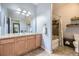 Clean bathroom with a shower-tub and vanity with a large mirror at 1465 Blue Sky Cir # 17-203, Erie, CO 80516