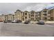Charming condo complex featuring beautiful stonework and convenient parking at 1465 Blue Sky Cir # 17-203, Erie, CO 80516