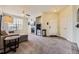 Comfortable living room features a fireplace, plush carpeting, and natural light at 1465 Blue Sky Cir # 17-203, Erie, CO 80516