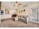 Inviting living room boasts a comfortable couch and access to dining area at 1465 Blue Sky Cir # 17-203, Erie, CO 80516