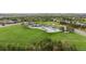 Aerial view of community pools, green space, and tennis courts at 16421 Askins Loop, Parker, CO 80134