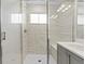 Bright bathroom features a stylish shower with sleek fixtures and ample natural light at 16421 Askins Loop, Parker, CO 80134