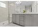 Modern bathroom features double vanity, and glass-enclosed shower for a spa-like experience at 16421 Askins Loop, Parker, CO 80134