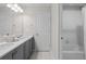 Bathroom featuring a double vanity, and a shower/tub combo, perfect for relaxation at 16421 Askins Loop, Parker, CO 80134
