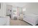 Cozy Bedroom features a crib, chair, and changing table, creating a warm atmosphere at 16421 Askins Loop, Parker, CO 80134