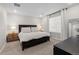 Bedroom features a bed with nightstands, dresser, and window for ample light at 16421 Askins Loop, Parker, CO 80134