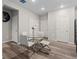 Bright dining area with silver accents and dark wooden floors at 16421 Askins Loop, Parker, CO 80134