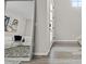 Bright living room with a large mirror, accent rug and grey walls at 16421 Askins Loop, Parker, CO 80134