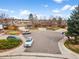 Aerial view of the property showcasing its location in a peaceful cul-de-sac neighborhood with mature trees and landscaping at 7604 S Lamar Ct, Littleton, CO 80128