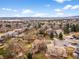 Aerial view highlighting the property's location in a mature neighborhood, showcasing nearby amenities and lush landscaping at 7604 S Lamar Ct, Littleton, CO 80128