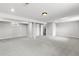 Large finished basement area with fresh carpet and paint, providing plenty of flexible living or storage space at 7604 S Lamar Ct, Littleton, CO 80128