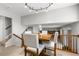 Cozy dining area featuring stylish chairs and a view to living room below at 7604 S Lamar Ct, Littleton, CO 80128