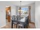 Elegant dining room featuring a modern table and stylish curtains at 7604 S Lamar Ct, Littleton, CO 80128