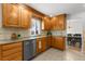 Spacious kitchen with granite countertops and stainless steel dishwasher at 7604 S Lamar Ct, Littleton, CO 80128