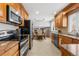 Well-equipped kitchen with stainless steel appliances and granite countertops at 7604 S Lamar Ct, Littleton, CO 80128