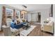 Comfortable living room with large windows and stylish decor at 7604 S Lamar Ct, Littleton, CO 80128