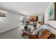Cozy living room with sliding glass door, backyard view, and adjacent kitchen at 7604 S Lamar Ct, Littleton, CO 80128