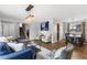 Cozy living area with stairs and adjacent dining space at 7604 S Lamar Ct, Littleton, CO 80128