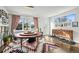 Bright dining room featuring a large round table, statement rug, and gallery wall at 4390 Osage St, Denver, CO 80211