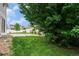 Lush backyard with vibrant green grass and mature tree at 5572 Killarney St, Denver, CO 80249