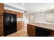 Kitchen featuring lots of light, modern appliances, and seamless transition to the dining area at 5572 Killarney St, Denver, CO 80249