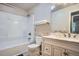 Bathroom featuring a vanity with marble countertop, bathtub, and shower at 8168 Washington St # 46, Denver, CO 80229