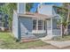 Inviting home exterior featuring a bay window, front porch, and garden bed at 8168 Washington St # 46, Denver, CO 80229