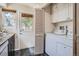 Laundry room featuring a washer, dryer, and convenient storage space at 8168 Washington St # 46, Denver, CO 80229