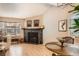 Inviting living room featuring hardwood floors, fireplace, and plenty of natural light at 8168 Washington St # 46, Denver, CO 80229