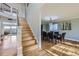 Elegant dining room with hardwood floors, staircase, and natural light at 10984 Alcott Dr, Denver, CO 80234
