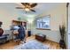 Well-lit home office featuring hardwood floors, neutral paint colors, and a ceiling fan at 10984 Alcott Dr, Denver, CO 80234