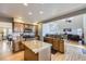 Modern kitchen with island, granite countertops, and stainless steel appliances at 10984 Alcott Dr, Denver, CO 80234