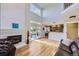 Bright living room featuring a fireplace, hardwood floors, and sliding glass doors at 10984 Alcott Dr, Denver, CO 80234