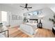 Comfortable bedroom featuring a ceiling fan and bright natural light from the windows at 2640 Central Ct # 204, Denver, CO 80211
